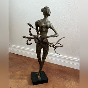 Metal women with bouquet statue